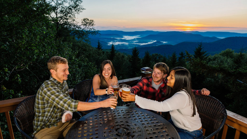 People enjoying a drink and a legendary snowshoe sunsets
