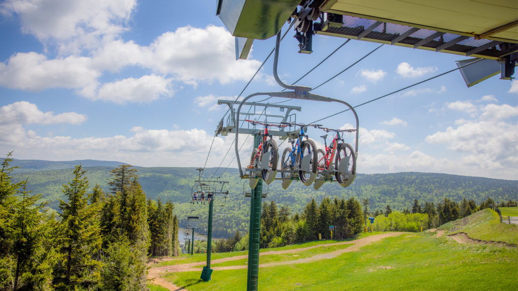 Mountain Bike on Chairlift in the summer at Snowshoe Mountain